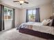 Bedroom features large windows and a ceiling fan at 4151 S Lewiston Cir, Aurora, CO 80013