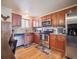 Eat-in kitchen features stainless steel appliances, granite countertops and wood cabinets at 4151 S Lewiston Cir, Aurora, CO 80013