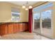 Dining area with wood floors and sliding glass doors leading to the outdoor deck at 7054 S Fultondale Cir, Aurora, CO 80016