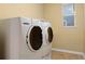 This laundry room features newer model washer and dryer appliances at 7054 S Fultondale Cir, Aurora, CO 80016