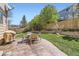 Landscaped backyard featuring a stamped concrete patio perfect for outdoor seating at 3744 Gypsum Ct, Superior, CO 80027