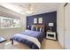 Bedroom features a large window, neutral walls, and an en suite bathroom with generous lighting at 3744 Gypsum Ct, Superior, CO 80027