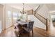 Dining room with wood floors, traditional chandelier and staircase at 3744 Gypsum Ct, Superior, CO 80027