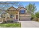 Charming two-story home with a manicured lawn, covered porch and a two car garage at 3744 Gypsum Ct, Superior, CO 80027