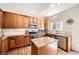 Traditional kitchen featuring stainless appliances, granite countertops, and wood flooring at 3744 Gypsum Ct, Superior, CO 80027