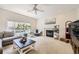Bright living room with large window and fireplace at 3744 Gypsum Ct, Superior, CO 80027