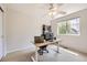 Bright home office with a standing desk, modern chair, neutral walls, and natural light at 3744 Gypsum Ct, Superior, CO 80027