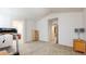 Spacious bedroom with a treadmill, neutral paint, and views into the bathroom at 14230 Lakeview Ln, Broomfield, CO 80023