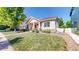 Beautifully landscaped front yard of a lovely home with a well-manicured lawn and a charming entrance at 14230 Lakeview Ln, Broomfield, CO 80023