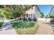 Charming home with red shutters, a garden, and stone landscaping at 14230 Lakeview Ln, Broomfield, CO 80023