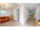 Bright hallway with open access to living room and modern furnishings at 14230 Lakeview Ln, Broomfield, CO 80023