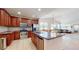 Spacious kitchen with stainless steel appliances, a large island, and ample counter space at 14230 Lakeview Ln, Broomfield, CO 80023