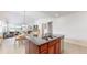 Open concept kitchen and dining area with views of the living room and a cozy fireplace at 14230 Lakeview Ln, Broomfield, CO 80023