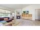 Cozy living area with fireplace and lots of natural light from surrounding windows at 14230 Lakeview Ln, Broomfield, CO 80023