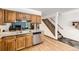 Well-lit kitchen with stainless steel dishwasher, light countertops and wooden cabinets at 800 Illinois St # 1, Golden, CO 80401