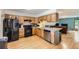 Functional kitchen features modern appliances, wood cabinets, and open layout at 800 Illinois St # 1, Golden, CO 80401
