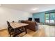 Inviting dining area with wood floors that flow into the living room with fireplace at 800 Illinois St # 1, Golden, CO 80401