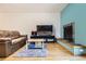 Comfortable living room features fireplace, hardwood floors and calming blue accent wall at 800 Illinois St # 1, Golden, CO 80401