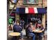 Outdoor seating outside of D' Deli Latino restaurant on a busy street at 800 Illinois St # 1, Golden, CO 80401