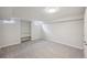 Finished basement offering neutral carpet, built in shelving, and a window at 1219 S Yosemite Way # 63, Denver, CO 80247