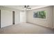 Bedroom featuring a window, closet with sliding doors and light colored carpeted flooring at 1219 S Yosemite Way # 63, Denver, CO 80247