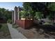 Charming townhouse exterior with brick accents and a fenced front yard at 1219 S Yosemite Way # 63, Denver, CO 80247