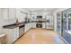Bright kitchen featuring stainless steel appliances, white cabinets, and sliding glass door to the backyard at 1219 S Yosemite Way # 63, Denver, CO 80247