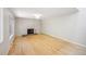Spacious living room with hardwood floors, modern lighting, and painted brick fireplace, offering a cozy space at 1219 S Yosemite Way # 63, Denver, CO 80247