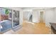 Open-concept living space with hardwood floors and sliding glass door to outdoor area, combining indoor and outdoor living at 1219 S Yosemite Way # 63, Denver, CO 80247