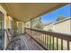 Private balcony with wooden deck, two chairs, and views of the courtyard at 3452 S Eagle St # 201, Aurora, CO 80014