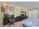 Spacious bedroom with a home office setup and large bed at 3452 S Eagle St # 201, Aurora, CO 80014