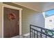 Condo entryway with a dark wood door and fall-themed wreath at 3452 S Eagle St # 201, Aurora, CO 80014