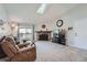 Living room with sectional sofa, recliner, fireplace and TV at 3452 S Eagle St # 201, Aurora, CO 80014