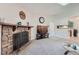 Stone fireplace in living room, adjacent to kitchen at 3452 S Eagle St # 201, Aurora, CO 80014