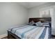 Charming bedroom with a queen bed and striped bedding at 521 E 14Th Ave # 18, Denver, CO 80203