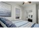 Comfortable bedroom with a queen bed and mirrored closet at 521 E 14Th Ave # 18, Denver, CO 80203