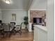 Bright dining area with glass table and four chairs, adjacent to living room at 521 E 14Th Ave # 18, Denver, CO 80203