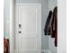 Simple entryway with coat hooks and door at 521 E 14Th Ave # 18, Denver, CO 80203