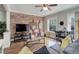 Inviting living room showcasing a brick accent wall and ample natural light at 521 E 14Th Ave # 18, Denver, CO 80203