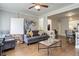 Living room with gray sofa, coffee table, and hardwood floors at 521 E 14Th Ave # 18, Denver, CO 80203