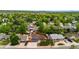 Aerial view of property in a well established neighborhood with mature trees at 7350 Devinney Ct, Arvada, CO 80005