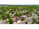 Another aerial view of the property in a neighborhood with established trees at 7350 Devinney Ct, Arvada, CO 80005