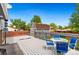 Outdoor deck perfect for entertaining and dining, featuring blue chairs and a table at 7350 Devinney Ct, Arvada, CO 80005