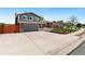 Two-story home with a wide driveway and mature trees at 7350 Devinney Ct, Arvada, CO 80005