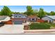 Charming two-story home with a well-maintained front yard and a two car garage, perfect for suburban living at 7350 Devinney Ct, Arvada, CO 80005