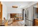 Open concept kitchen leading into the living area, featuring stainless steel appliances at 7350 Devinney Ct, Arvada, CO 80005