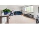 Bright living room featuring a large window offering great natural light and plush seating at 7350 Devinney Ct, Arvada, CO 80005