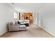 Comfortable living area with natural light, leading to the upper level and other rooms at 7350 Devinney Ct, Arvada, CO 80005