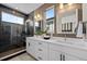 Chic bathroom with a glass-enclosed shower, dual sinks, and contemporary finishes at 1793 W 166Th Ave, Broomfield, CO 80023
