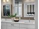 Elegant bathroom with dual sinks, modern fixtures, and stylish mirrors for a luxurious feel at 1793 W 166Th Ave, Broomfield, CO 80023